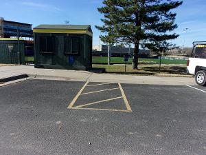 Photo of ADA parking just east of entrance by first base side field.