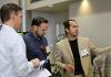 Two judges listen to Nick Vasilescu, from Testkey pitch.