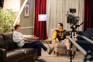 Acting for Digital Arts student on the sitcom set.