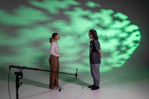 Acting students in front of the white backdrop in the film studios.