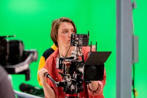 Student working a camera.