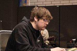 Student working on the soundboard.