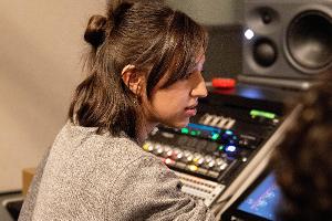 Student working on the soundboard.