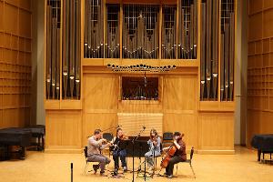 Students record a string quartet.