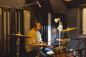 Audio production student uses the drum set.