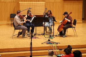 Students record a string quartet.