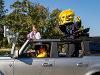 WuShock is a passenger in a car driven by a Wichita State employee during the annual Shocktoberfest parade.