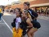 Members of the Shocker cheer team pose for a picture with a fan at Shocktoberfest.