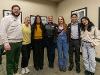 Dr. Monica Lounsbery, senior executive vice president and provost at Wichita State University, stands smiling with a group of seven students during a reception. They are standing in a row inside a room with framed black-and-white photos on the wall.
