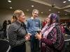 Dr. Monica Lounsbery, senior executive vice president and provost at Wichita State University, speaks with two attendees during a campus reception. They are standing and conversing in a crowded room filled with people.