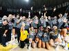 The Shocker volleyball team celebrates on the court after winning the American Athletic Conference Championship.