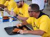 Baseball coach Brian Green eats corndogs at the Kansas State Fair Pronto Pup eating contest.