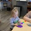 child playing with blocks at a table