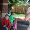 children playing with water outside