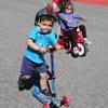 children on bikes and scooters