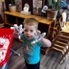 child showing his messy hands