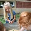 child holding a chick