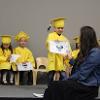 Children in graduation gown
