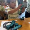 child playing with blocks at a table