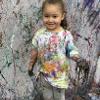 child covered with paint 