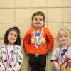 children with medals around their neck
