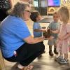 children petting an animal