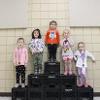 children on the award podium 