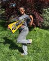 A student poses with a large WSU pennant.