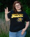 A student poses wearing a Wichita State Shockers shirt.