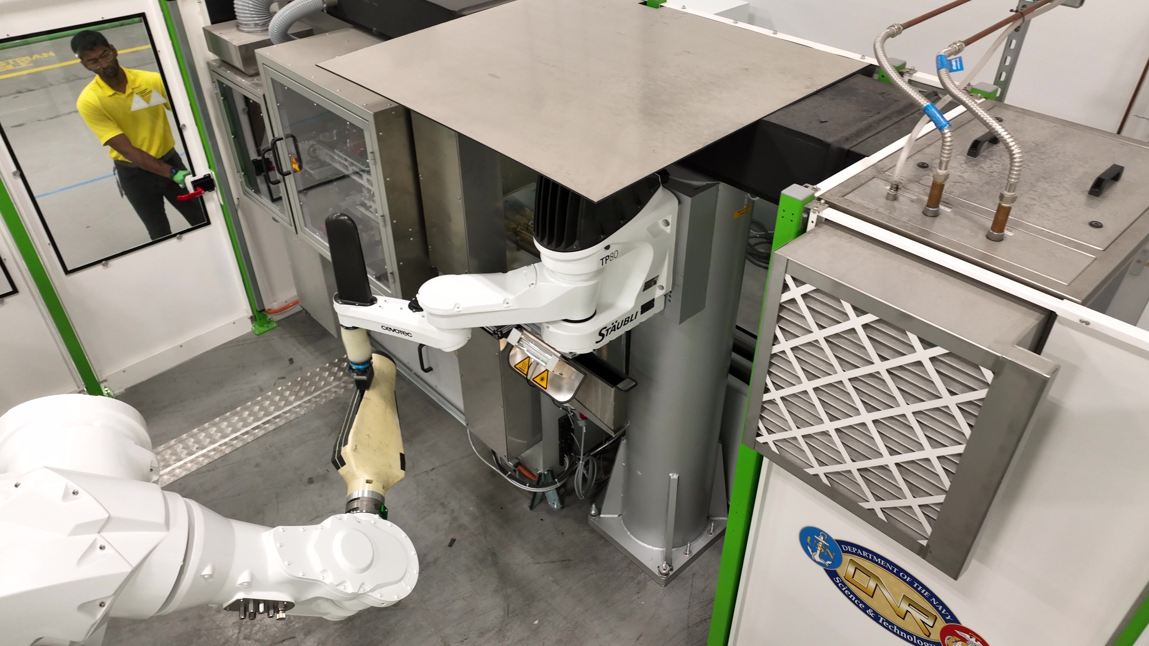 photo of robotic arms working with a specimen in the lab