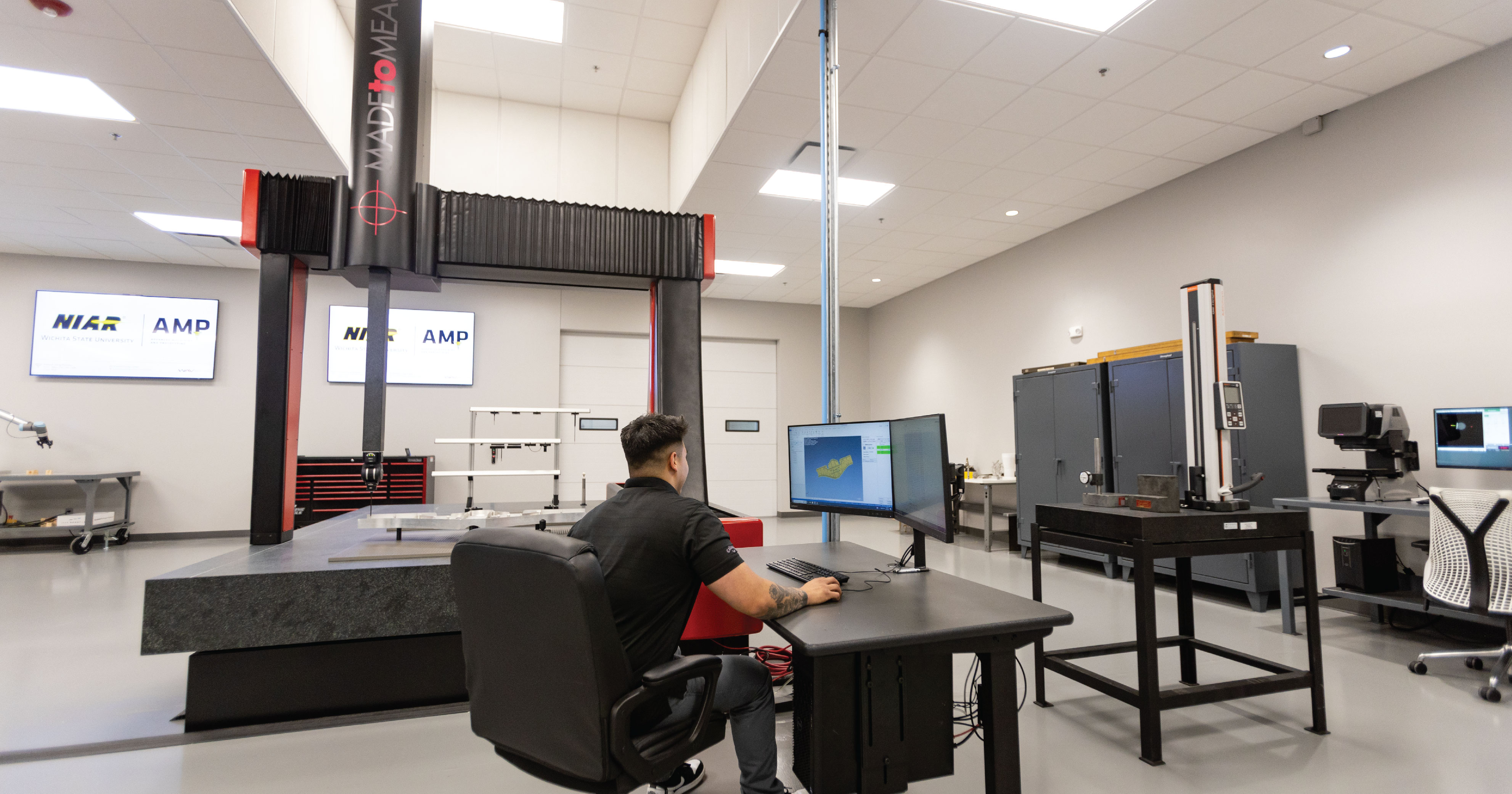 Employee at computer working on a project