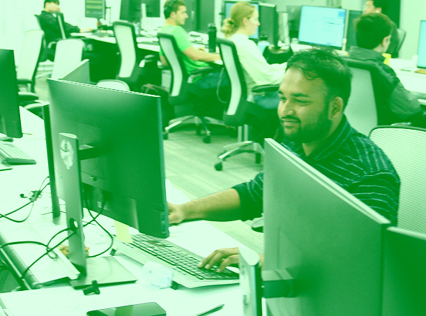 DEA TIE Team working at a computer.