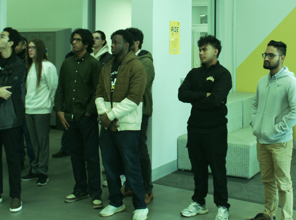 TIE team listening to a presentation.