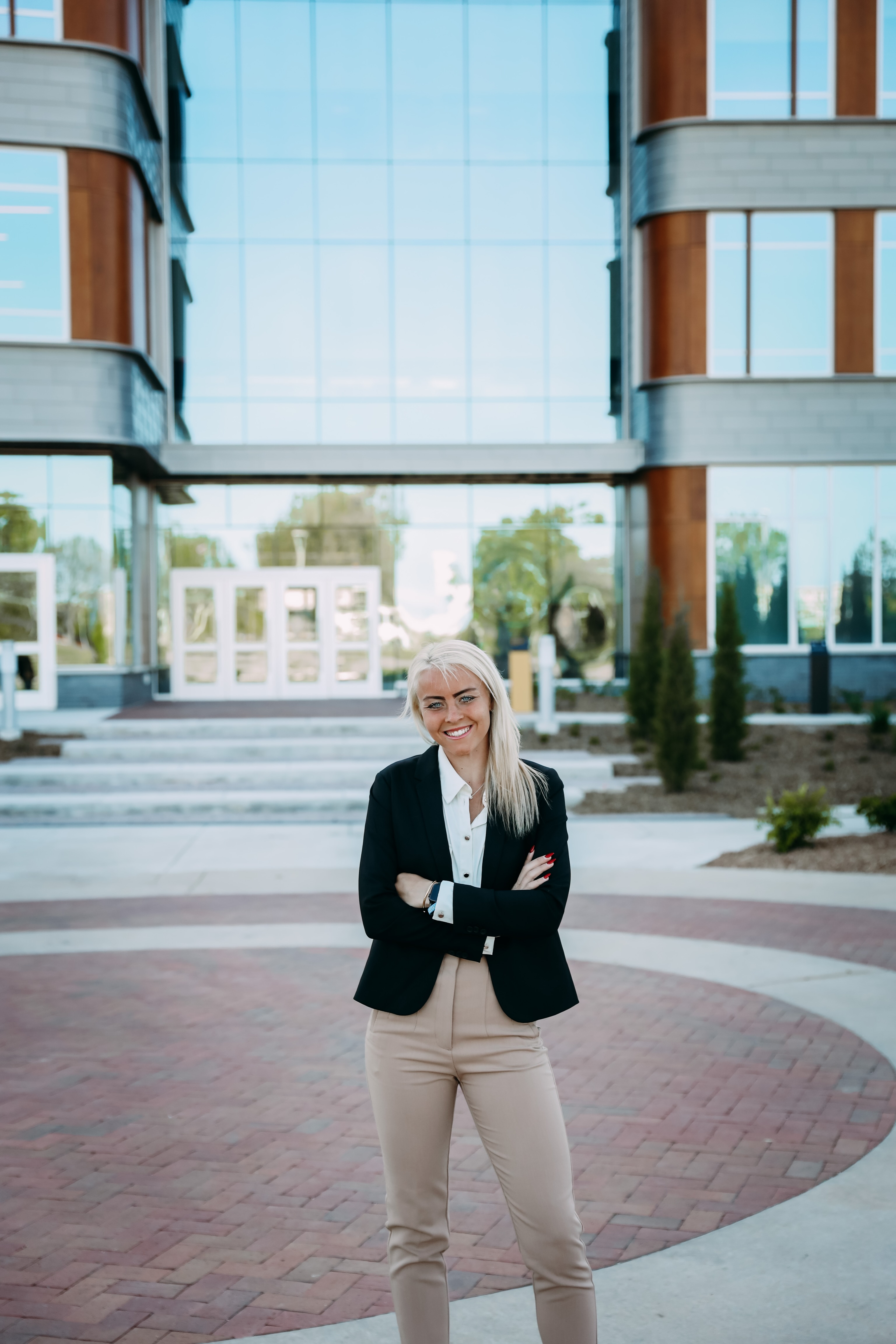 Photo of Harriet Hamilton in front of building.