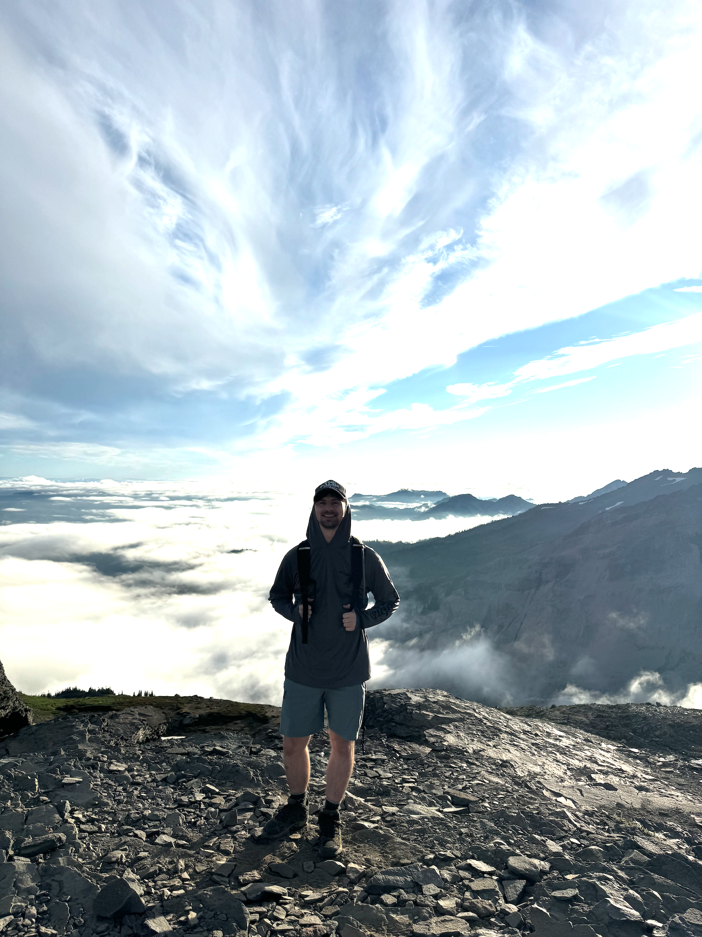 Photo of Andrew Gross hiking on a mountain