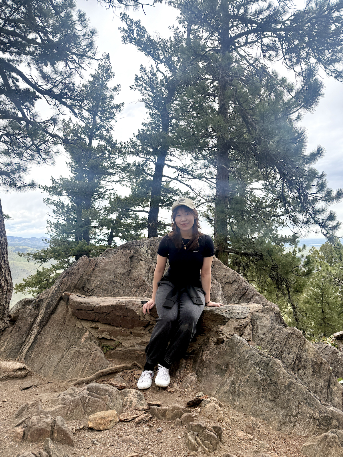 Photo of Christine Tran outside on a hiking path.
