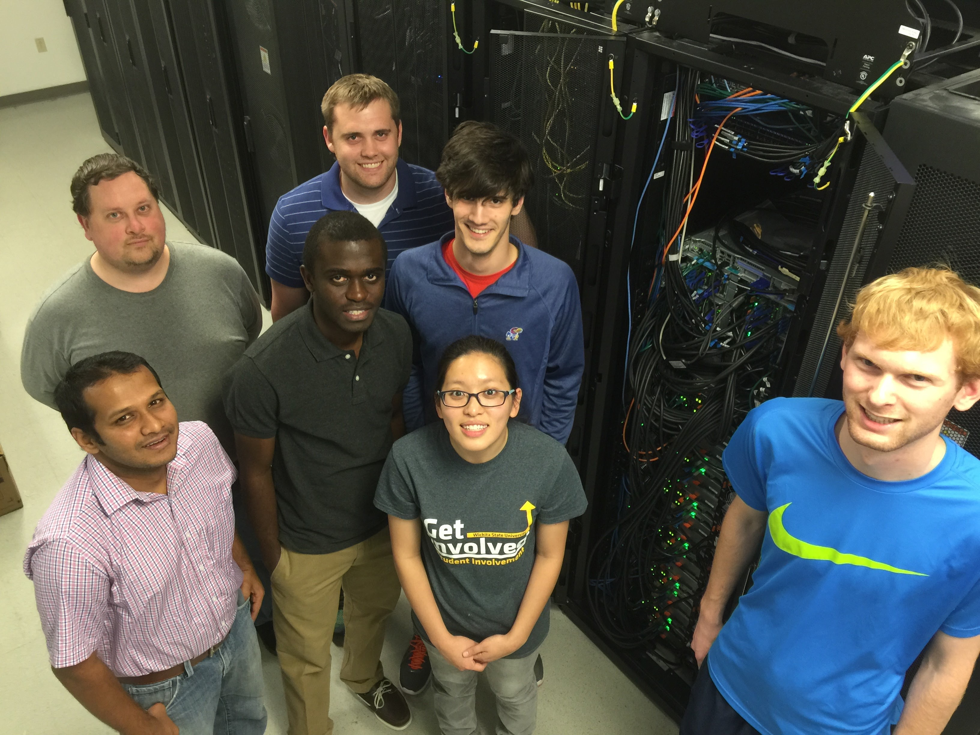 Photo of Blake Engels and others in a server room