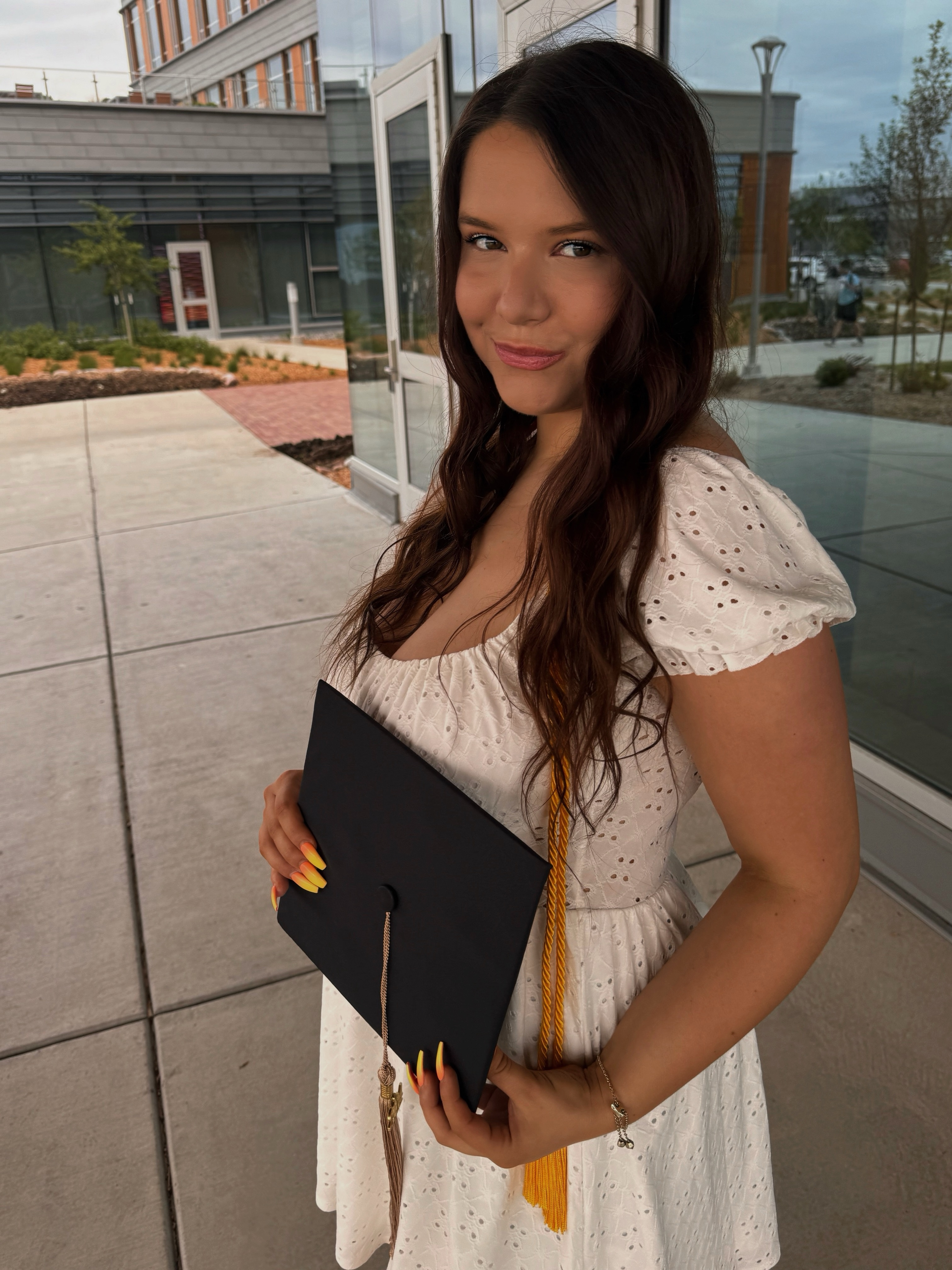Photo of Amber DeSmit with graduation cap