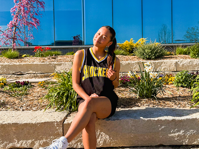 Photo of Emma Ewing outside in front of a university building