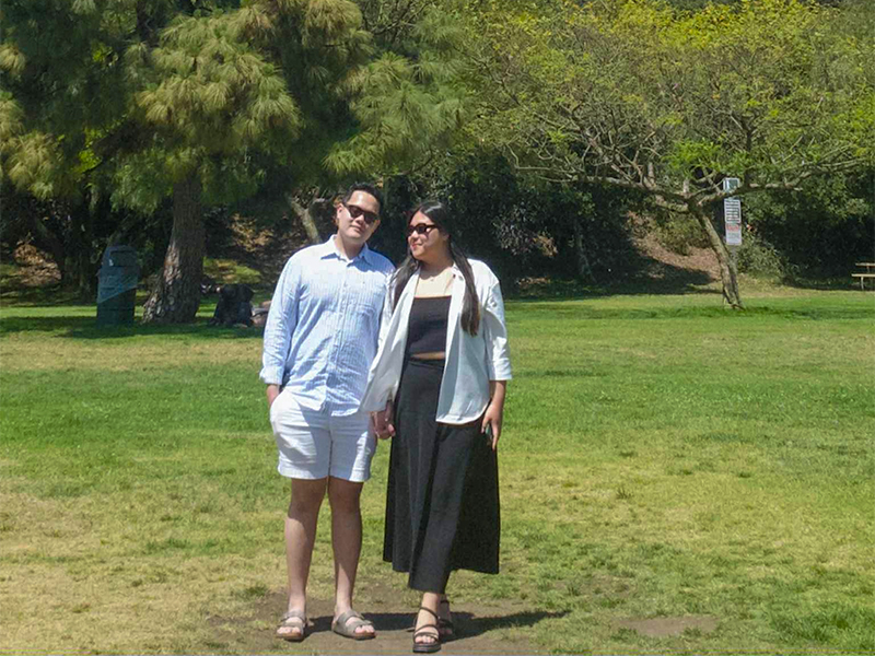 Photo of King Nguyen and one other in a park near the Hollywood sign