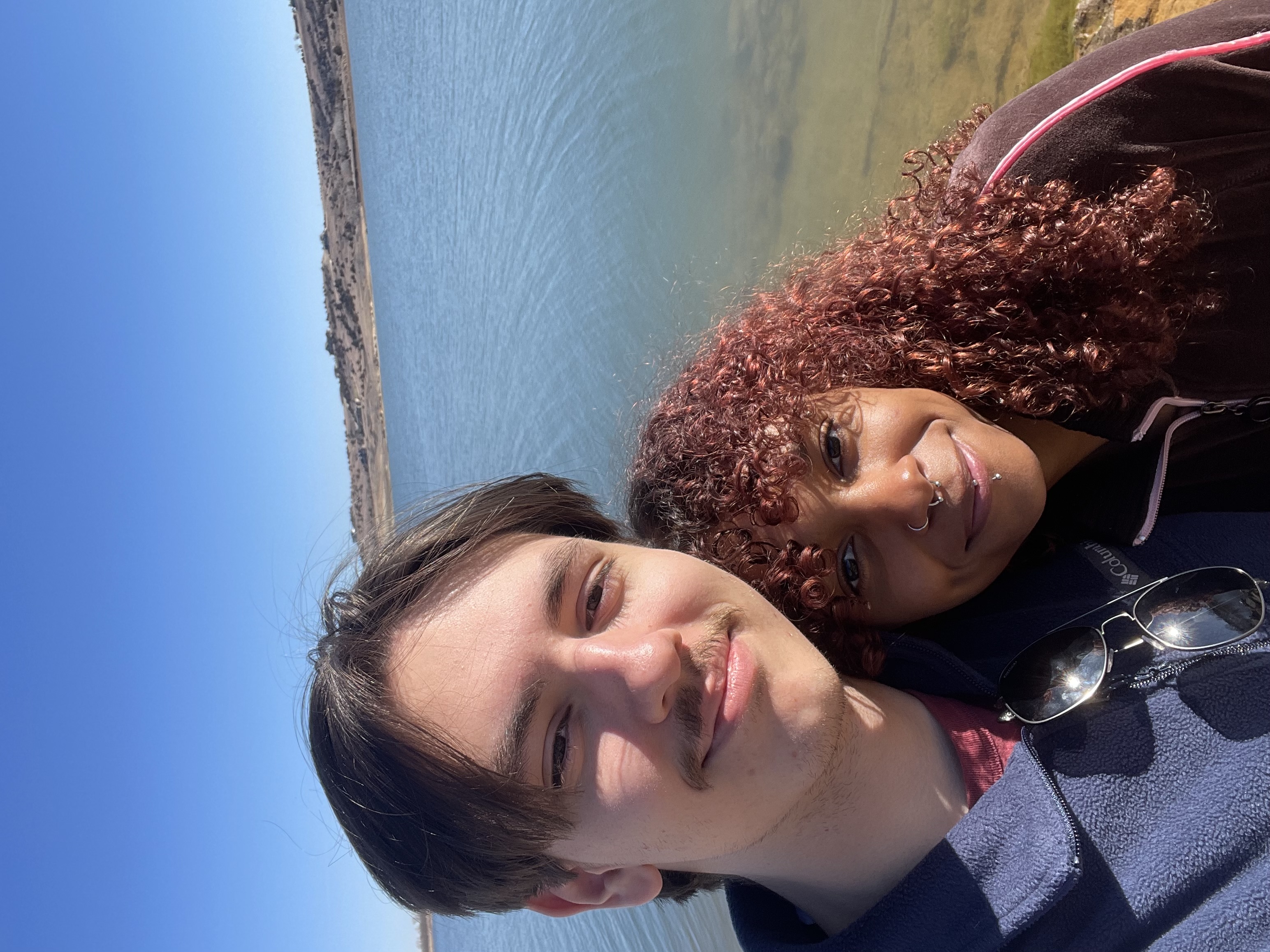 Photo of Mark Common and one other in front of a lake.