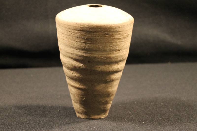 Medium-sized cone-shaped jar with grooved turning marks. 