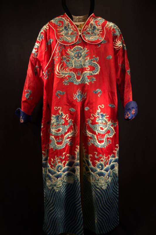 Red Hanfu with blue dragon design.