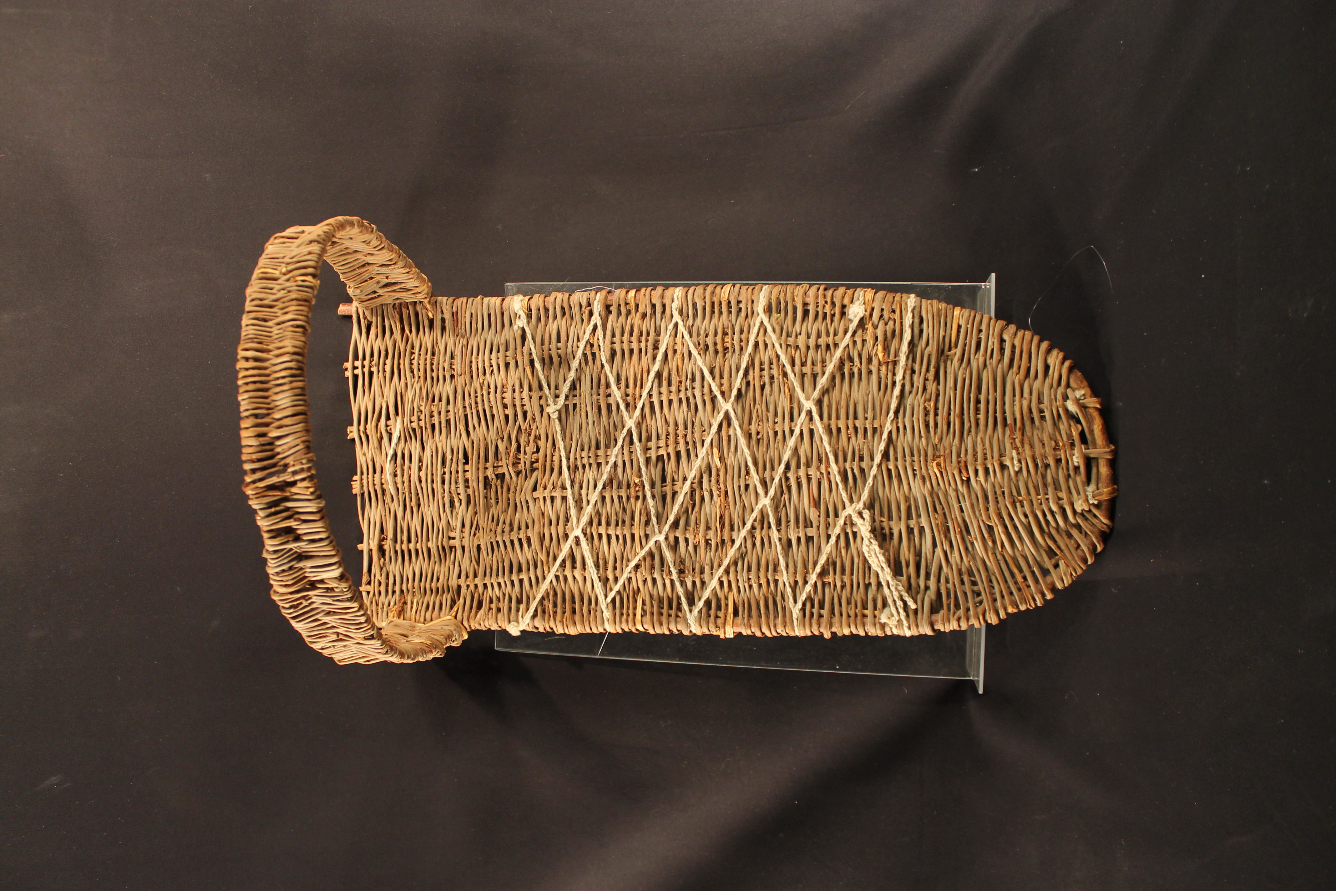 Woven board with arm in the middle that connects to both sides of the board.