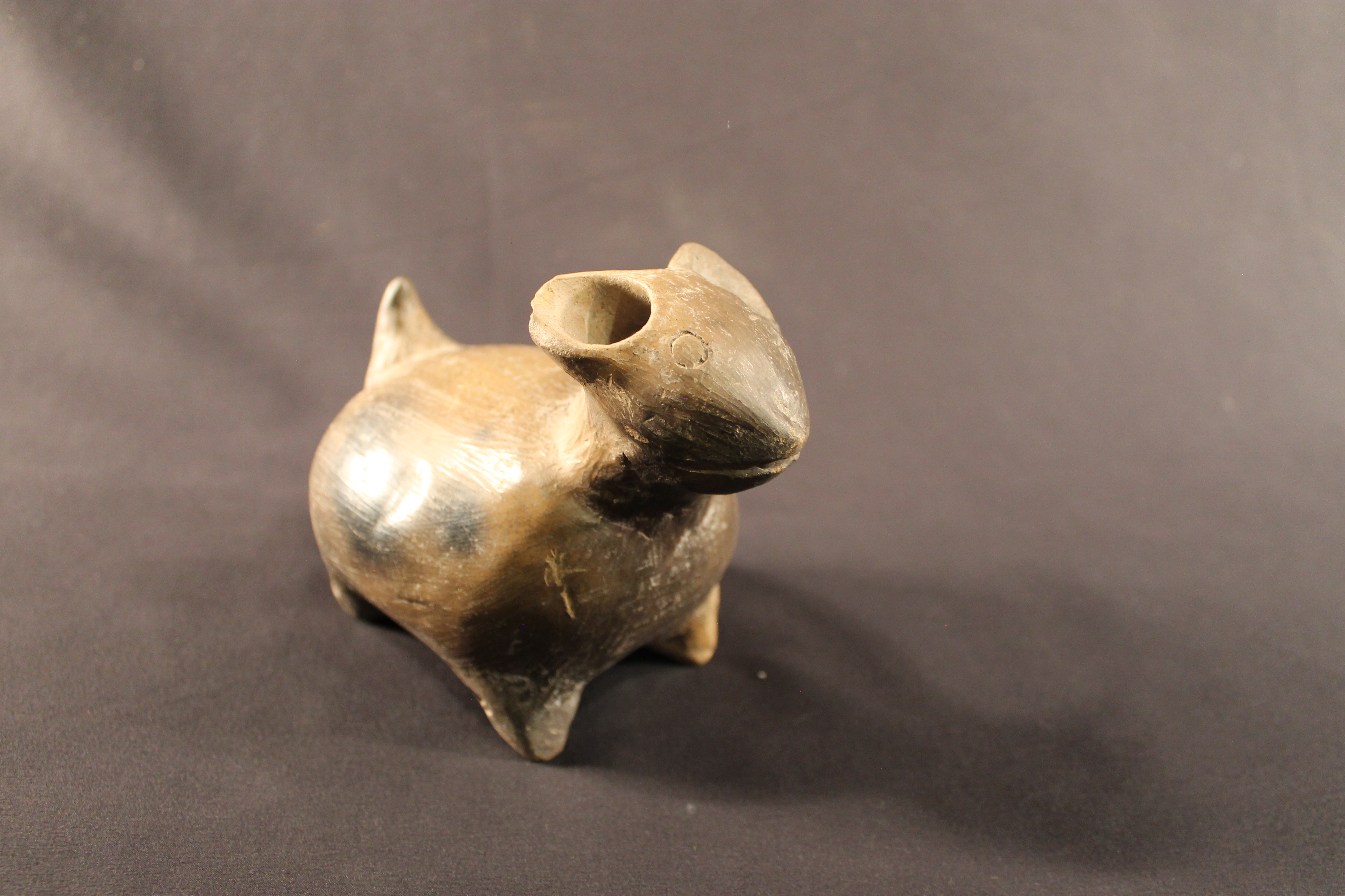 Ceramic statue of a dog.
