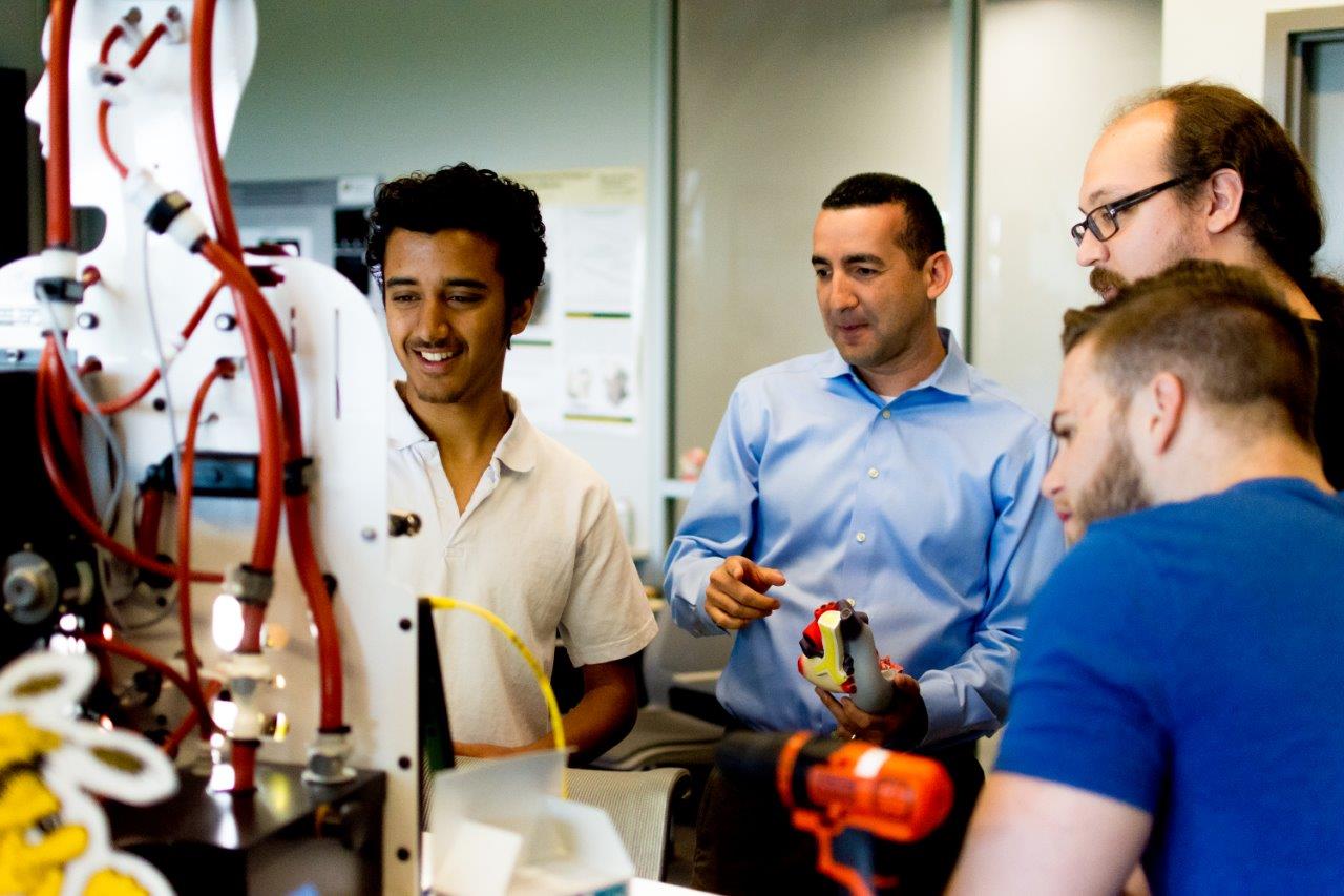 Photo of students working with interchangable blood model phantoms. 