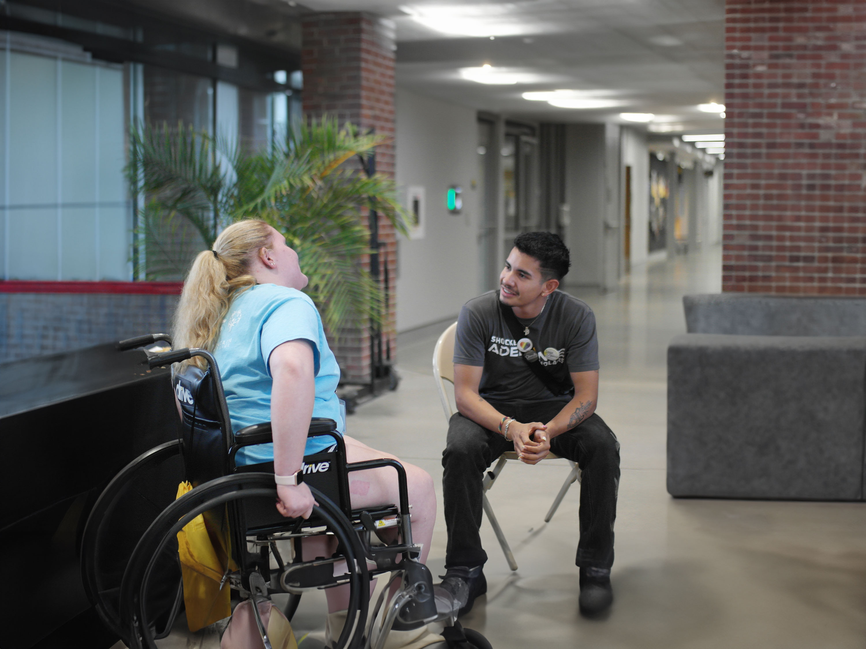 Two students talking to each other.