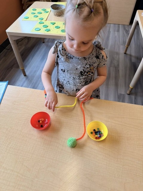 child playing with play dough