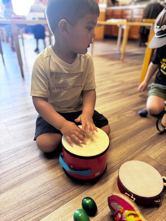 Child playing a drum