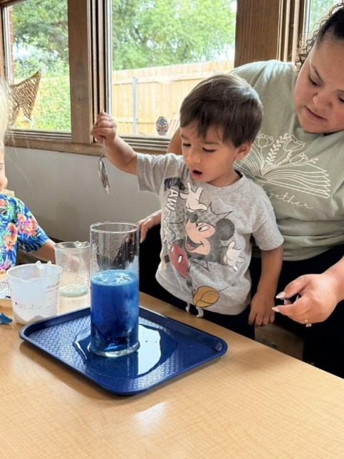 child doing a science experience